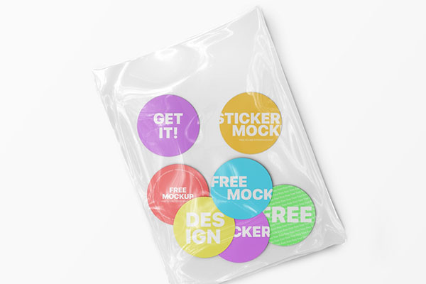 Top View of Seven Round Stickers in a Plastic Wrapping Mockup