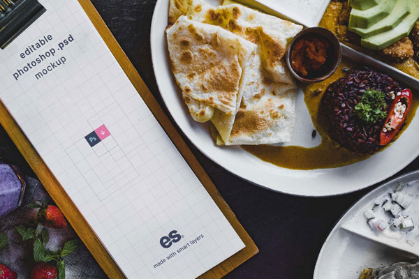 Top View of Tall Restaurant Menu Mockup on Dining Table