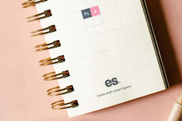 Top View of Vertical Spiral Notebook Mockup with Scrambled Papers