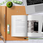 Top View Open Book Mockup Scene with Smartphone, and Plant
