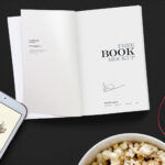 Top View Open Book on Desk Among Other Objects Mockup