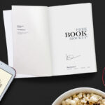 Top View Open Book on Desk Among Other Objects Mockup