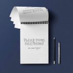 Top View Open Ringed Notepad Mockup with Pencil and Pen