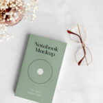 Top View Realistic Notebook with Glasses Mockup
