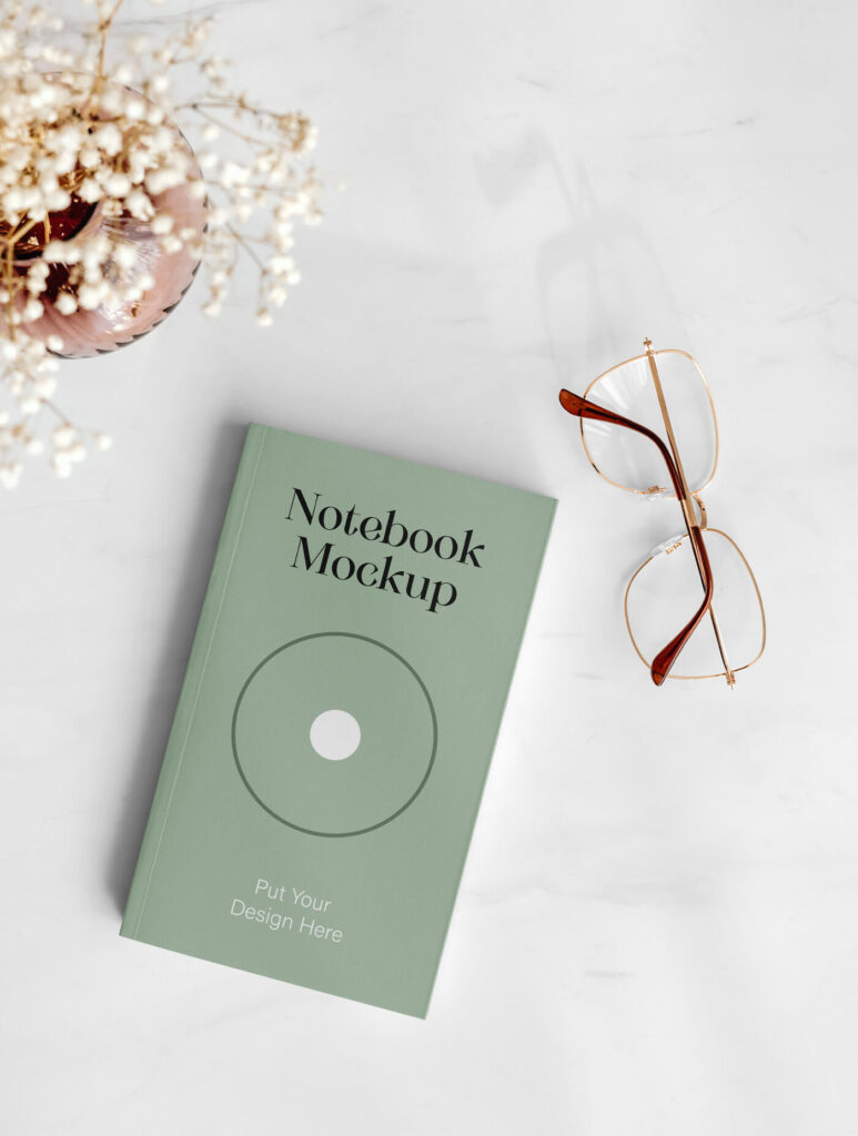 Top View Realistic Notebook with Glasses Mockup