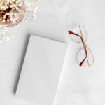 Top View Realistic Notebook with Glasses Mockup