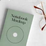 Top View Realistic Notebook with Glasses Mockup