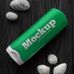 Top View Shampoo Bottle on Wooden Table Mockup with Seashells