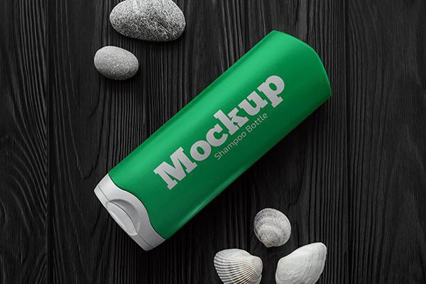 Top View Shampoo Bottle on Wooden Table Mockup with Seashells
