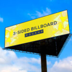 Triangle 3 Sided Single Stand Billboard in Blue Sky Mockup