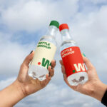 Two Bottle in Hand Mockups