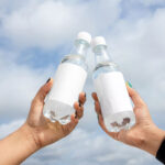 Two Bottle in Hand Mockups