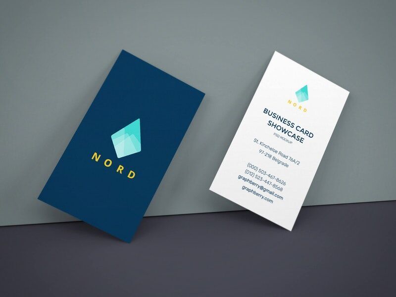 Two Business Cards Leaning Against The Wall Mockup