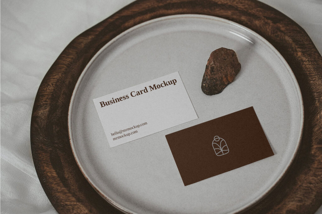 Two Business Cards on a Plate with a Little Rock Mockup