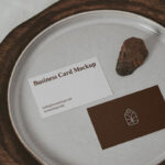 Two Business Cards on a Plate with a Little Rock Mockup