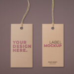 Two Embossed Hangtags Laid on the Surface in Top View Mockup