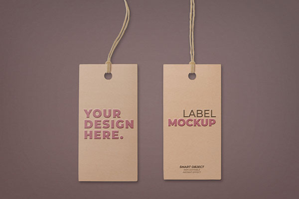 Two Embossed Hangtags Laid on the Surface in Top View Mockup