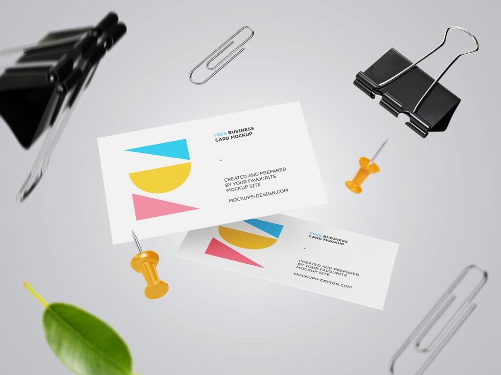 Two Falling Business Card Mockups with Floating Paper Clips