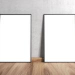 Two Framed Posters on Wooden Floor Leaning Against Wall Mockup
