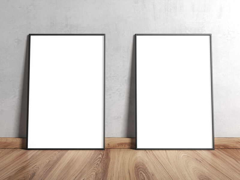 Two Framed Posters on Wooden Floor Leaning Against Wall Mockup