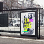 The Vertical Billboard in a Bus Stop with a Blurry Street Background Mockup