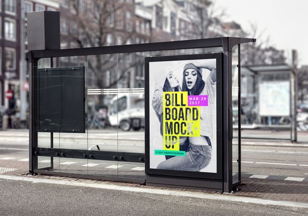 The Vertical Billboard in a Bus Stop with a Blurry Street Background Mockup