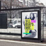 The Vertical Billboard in a Bus Stop with a Blurry Street Background Mockup