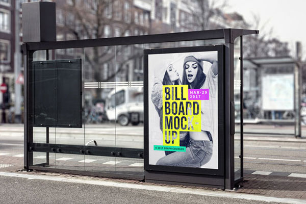 The Vertical Billboard in a Bus Stop with a Blurry Street Background Mockup