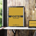 Indoor Mockup Featuring Photo Frame and Laptop with Front View