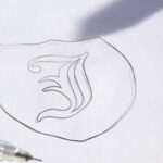 Two Logo Sketch on White Paper Mockups