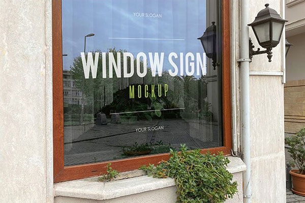 Two Mockups Featuring Perspective Views of Two Restaurant Window Signs