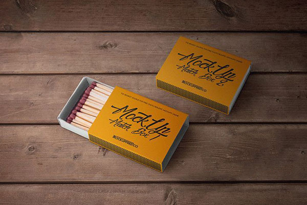 Two Mockups of Match Boxes on Wooden Surface