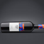 Two Mockups Showing Front View of Horizontal Wine Bottle