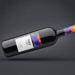 Two Mockups Showing Front View of Horizontal Wine Bottle