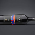Two Mockups Showing Front View of Horizontal Wine Bottle
