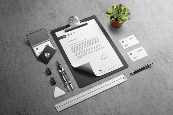 Two Mockups Showing Stationery Scenes of Letterhead and Business Cards