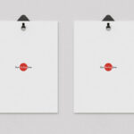 Two Posters Hanging From Clips on the Wall Mockup