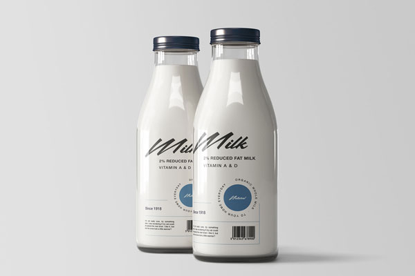 Two Shiny Glass Bottles Filled with Milk Mockup
