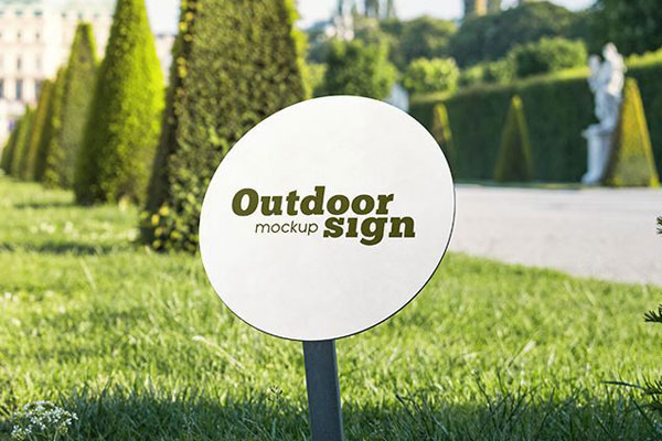 Two Small and Round Outdoor Sign Dip Into the Ground Mockups