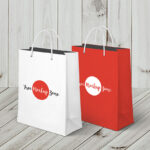 Two Vertical Shopping Bags with a Wooden Background Mockup
