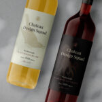 Two Wine Bottles Laying Besides Each other Mockup