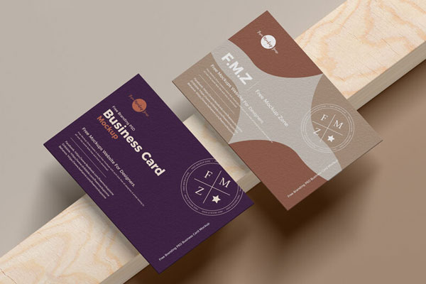 UK Size Business Card Mockup laying on a Wooden Piece