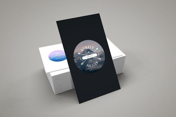 Vertical Business Card Leaning against Stack of Horizontal Cards Mockup