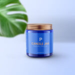 Vertical Candle Jar and Lid Mockup with a Large Leaf
