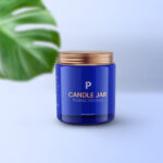 Vertical Candle Jar and Lid Mockup with a Large Leaf