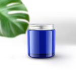 Vertical Candle Jar and Lid Mockup with a Large Leaf