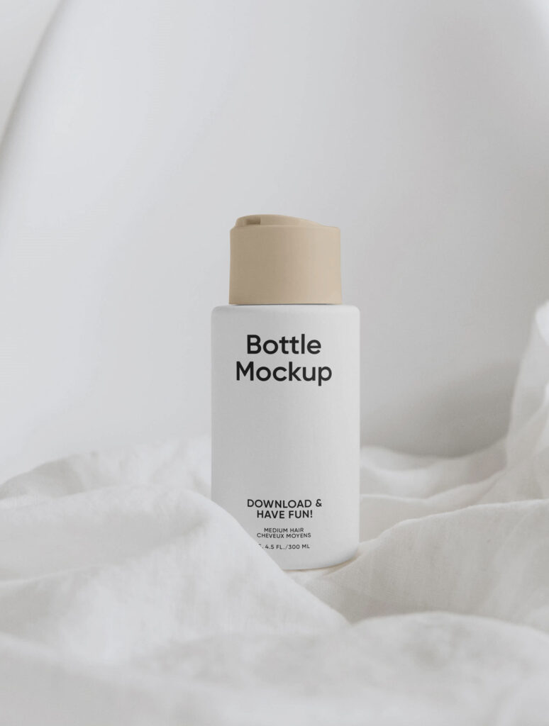 Vertical Cream Bottle on Fabric Mockup