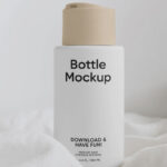 Vertical Cream Bottle on Fabric Mockup