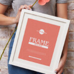 Vertical Photo Frame Mockup Featuring a Girl Holding it Diagonally