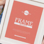 Vertical Photo Frame Mockup Featuring a Girl Holding it Diagonally
